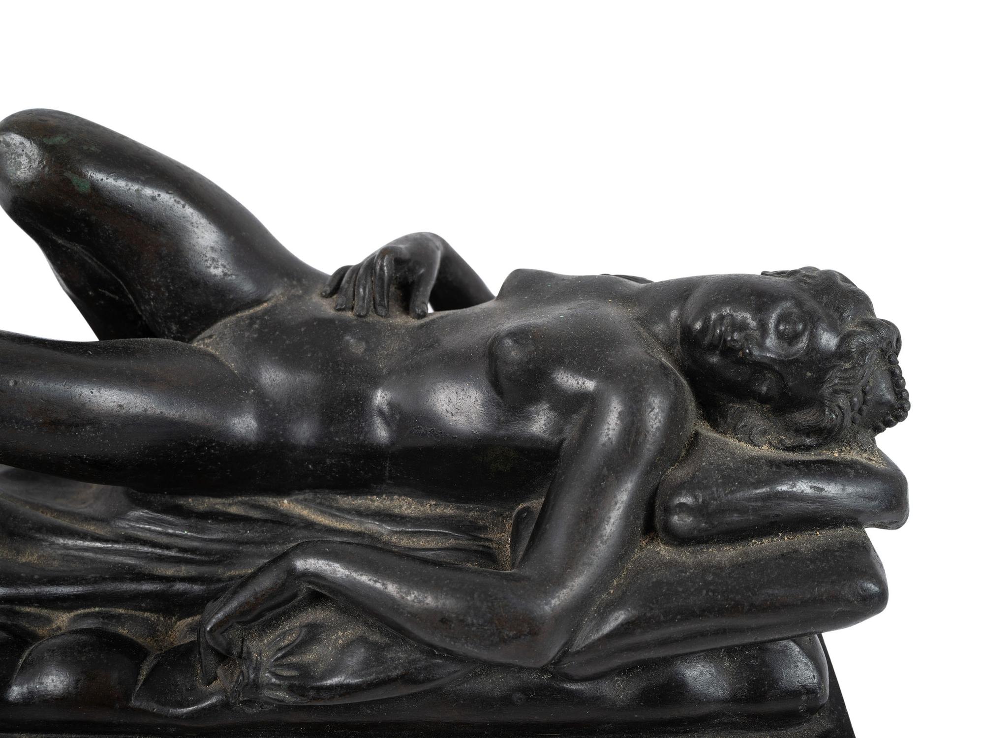 A Cast Bronze Figure of a Reclining Nude Woman