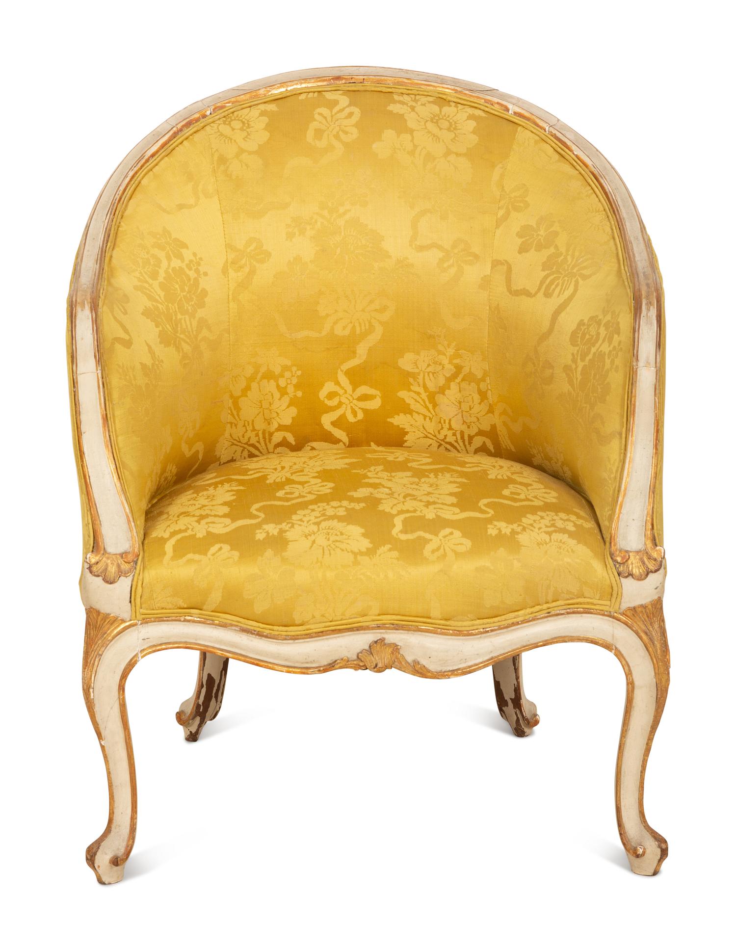A Louis XV Style Painted and Parcel Gilt Barrel Back Bergere