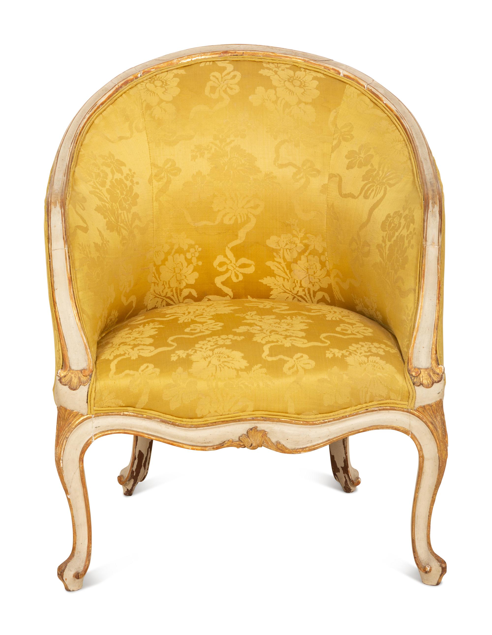A Louis XV Style Painted and Parcel Gilt Barrel Back Bergere