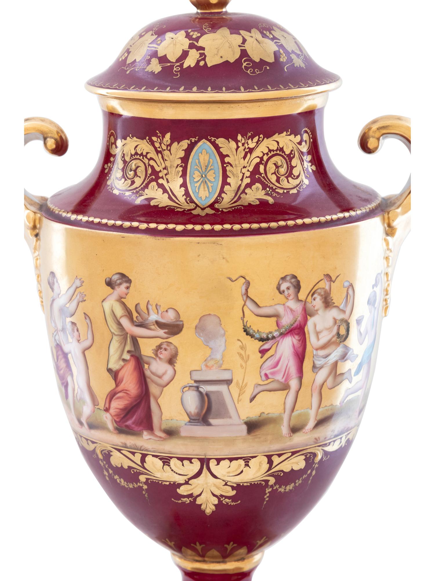A Vienna Style Painted and Parcel Gilt Porcelain Covered Urn