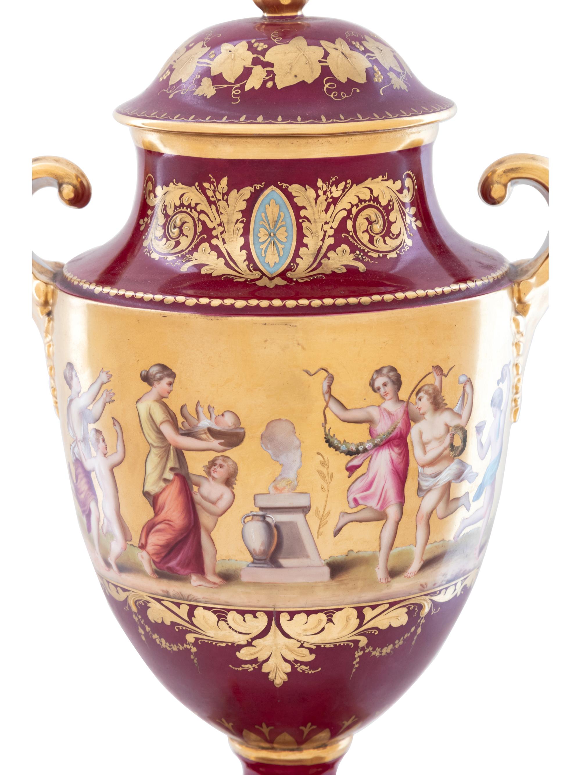 A Vienna Style Painted and Parcel Gilt Porcelain Covered Urn