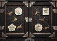 A Japanese Porcelain and Metal Inset Wood Chest