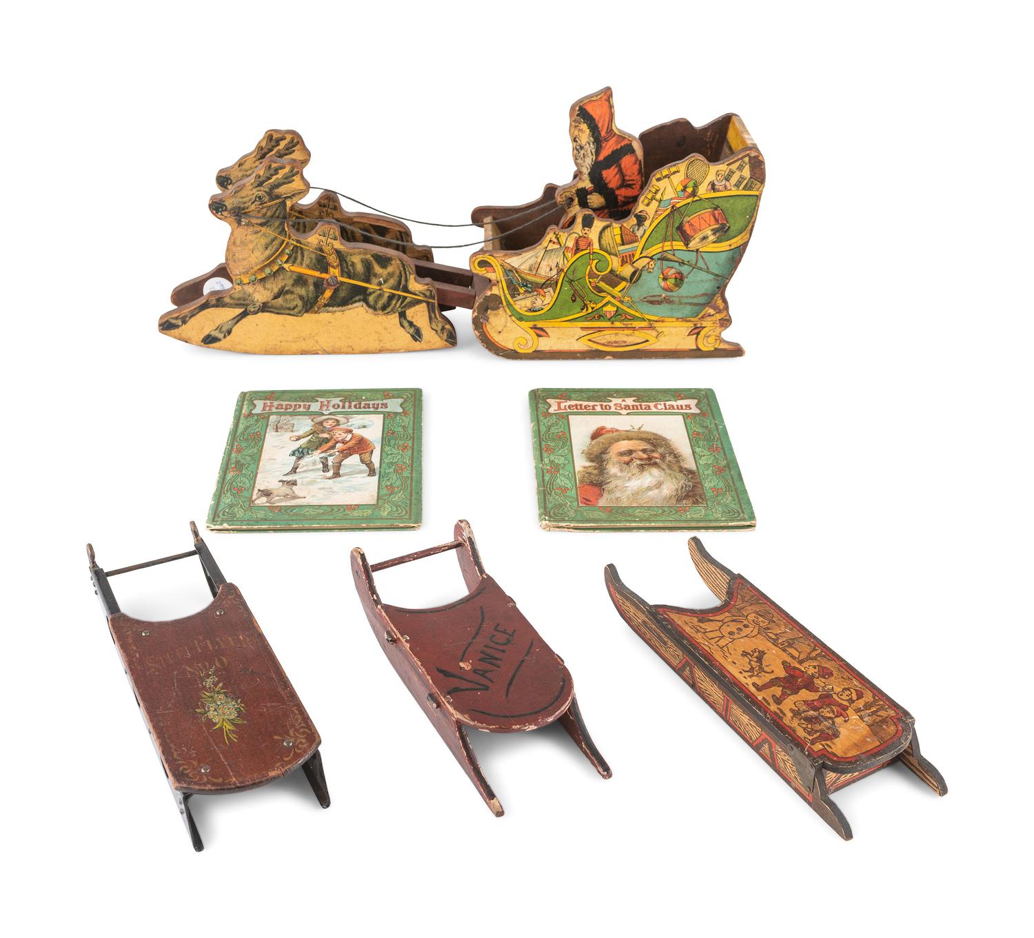 A Bliss Lithograph on Wood Santa on Sleigh and a Santa Claus on a Tin Sleigh