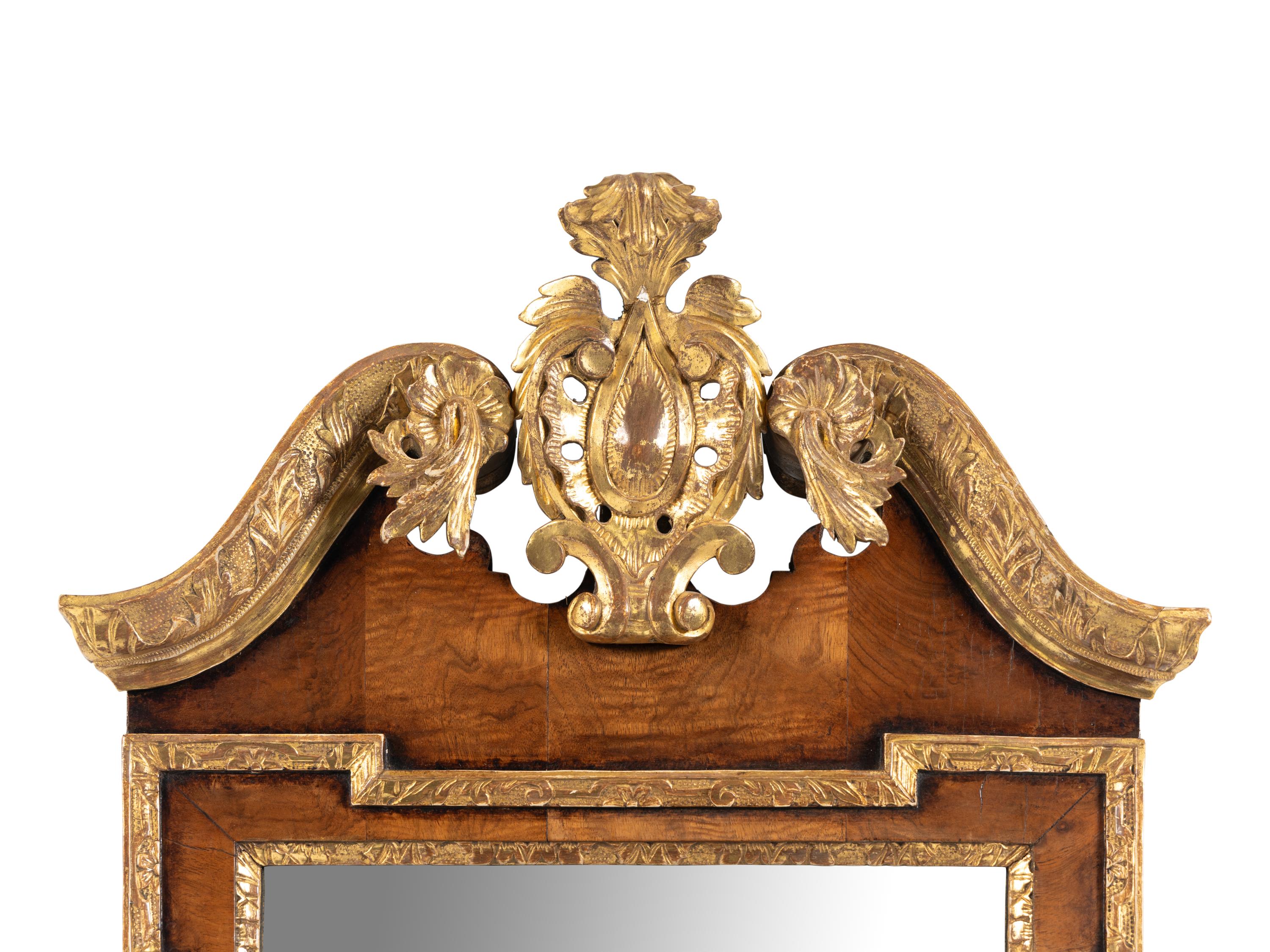 A George II Walnut and Parcel Gilt Girandole Mirror