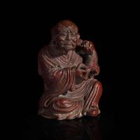 A Chinese finely-carved bamboo luohan and lion 竹雕笑狮罗汉 Qing dynasty ?