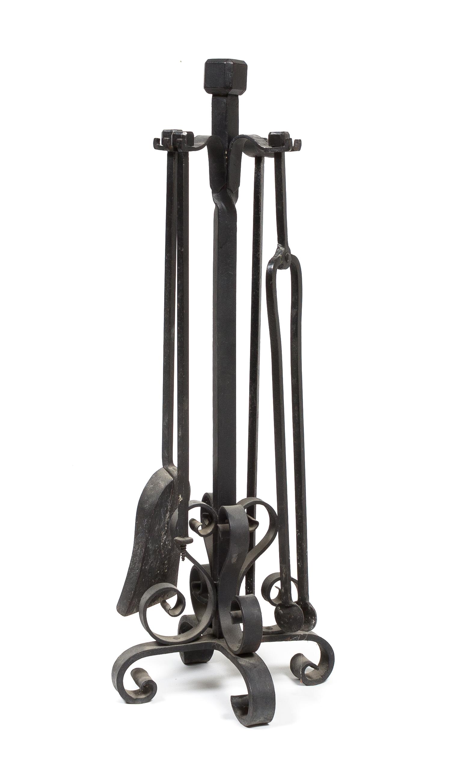 A Wrought Iron Fireplace Tool Set Height 33 inches. — 20TH CENTURY