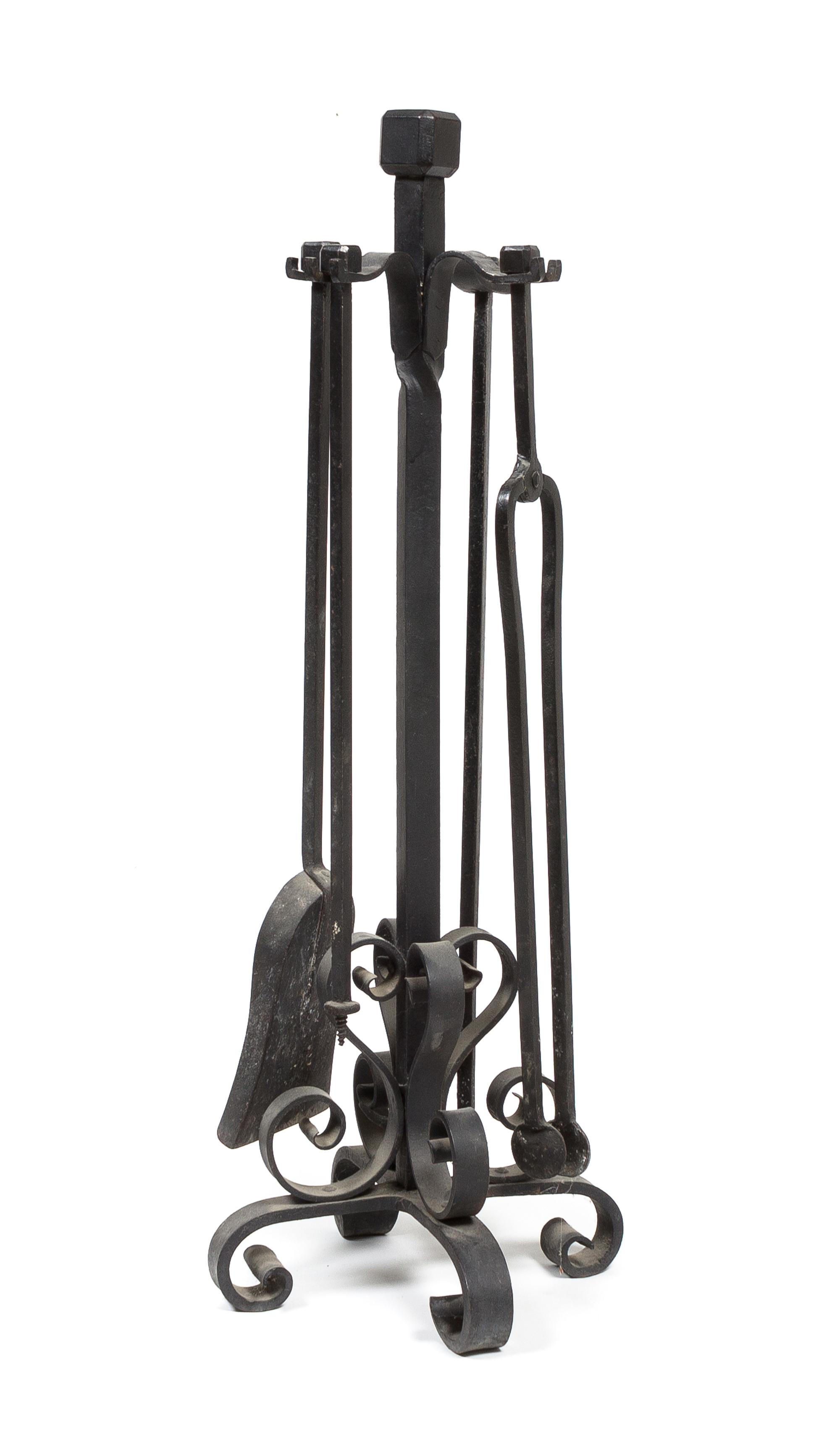 A Wrought Iron Fireplace Tool Set Height 33 inches. — 20TH CENTURY