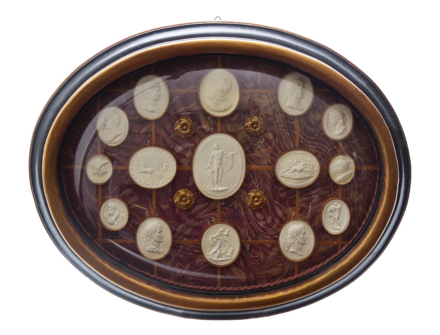 A Collection of Grand Tour Plaster Intaglios, Width of frame 17 inches.