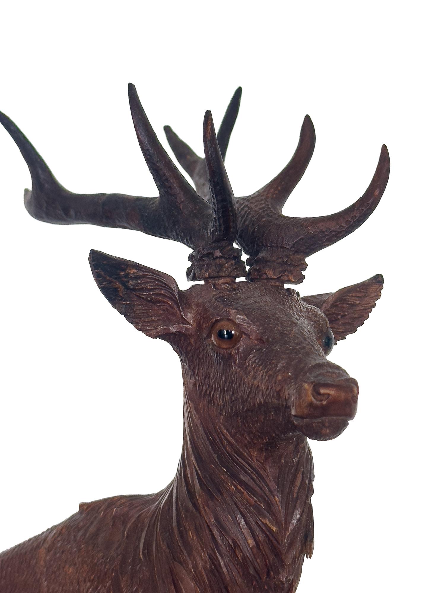 A Swiss Black Forest Carved Stag