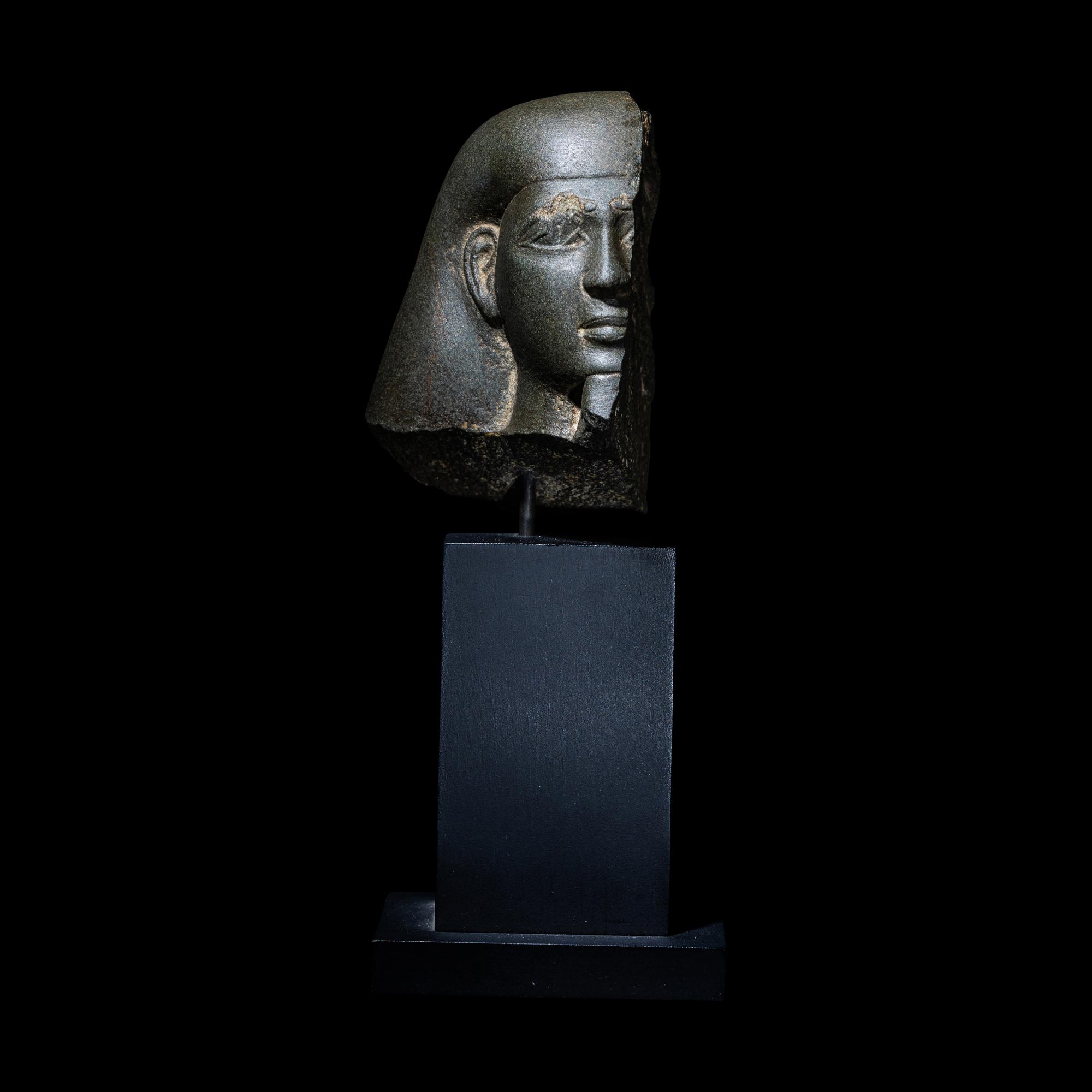 An Egyptian Schist Head of a Male