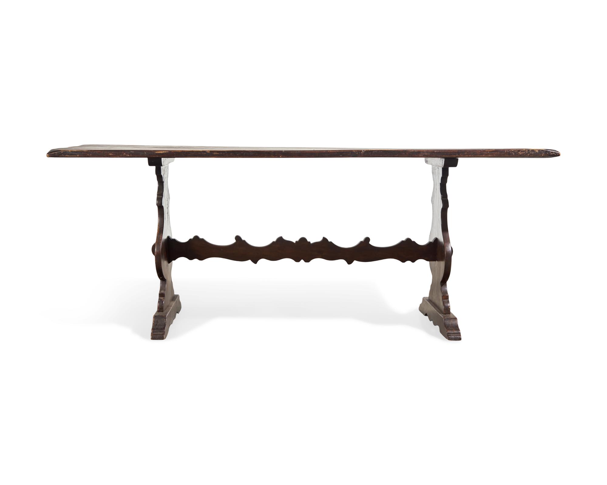 A Baroque Style Stained Fruitwood Trestle Table