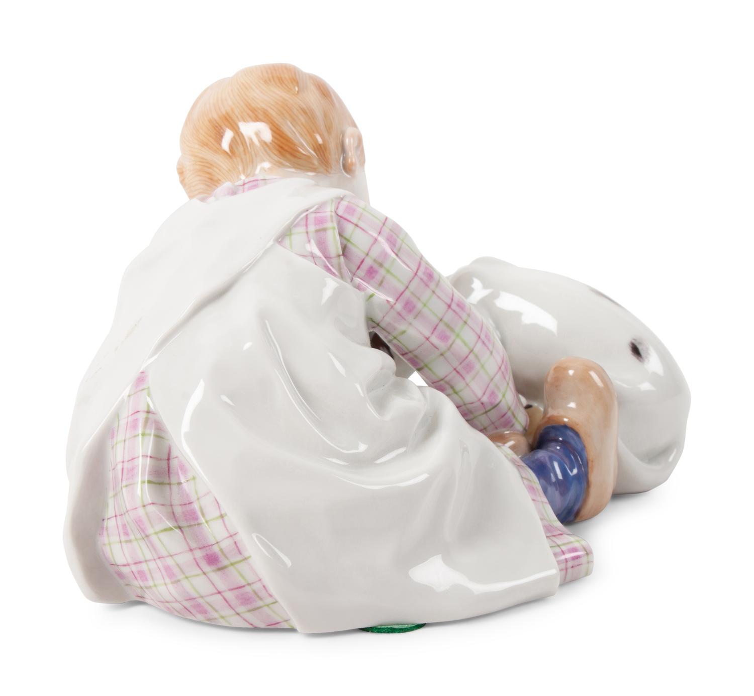 A Meissen Porcelain Figural Group of a Child Feeding Dog, by Konrad Hentschel