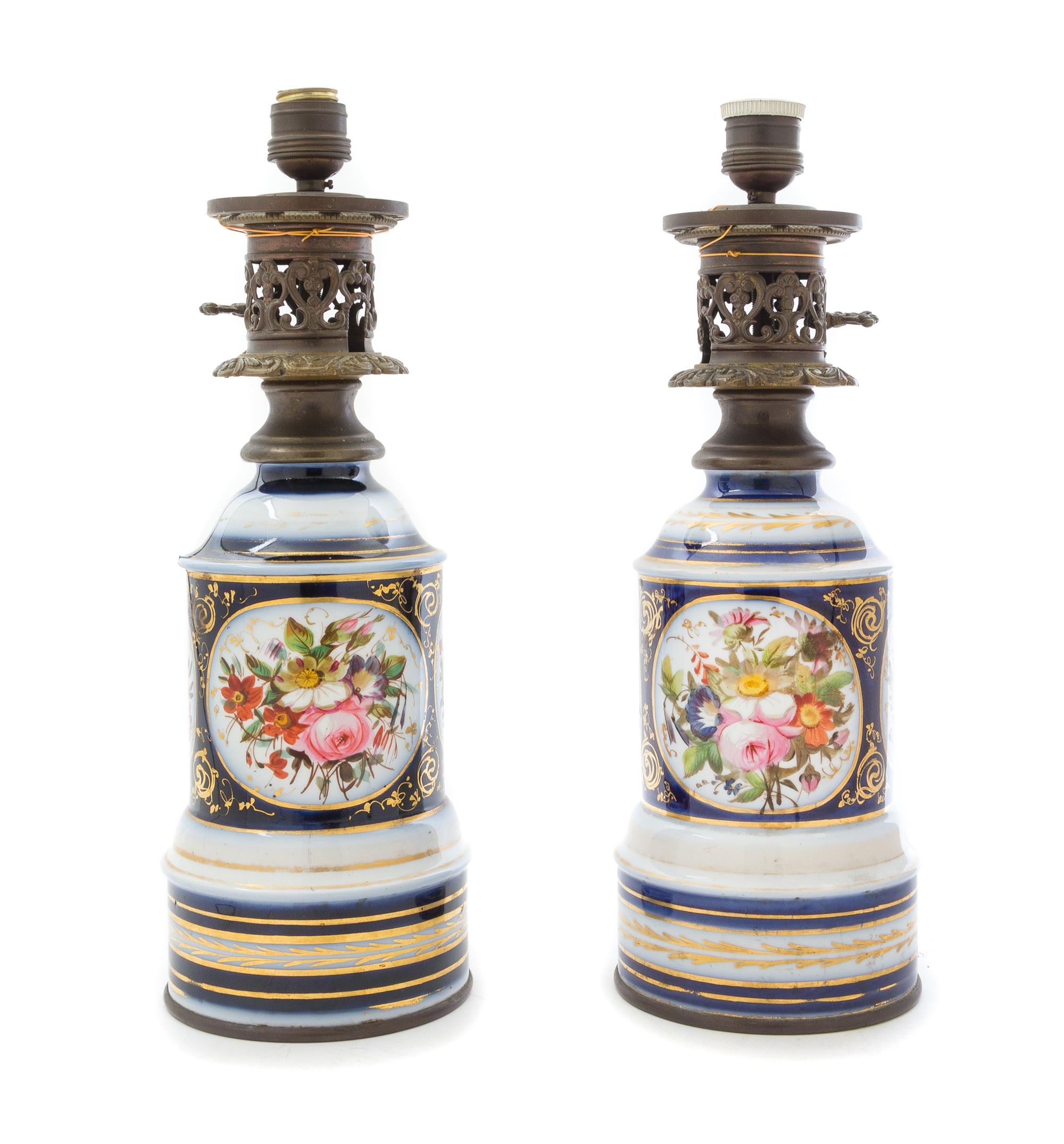 A Pair of Continental Porcelain Fluid Lamps Height of lamp base 15 1/4 inches. — 19TH CENTURY