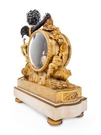 A Louis XVI Style Gilt and Patinated Bronze and Marble Clock
