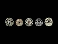 Five Chinese Pale Celadon Jade Carved and Reticulated Circular Pendants