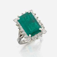 An emerald, diamond, and white gold ring