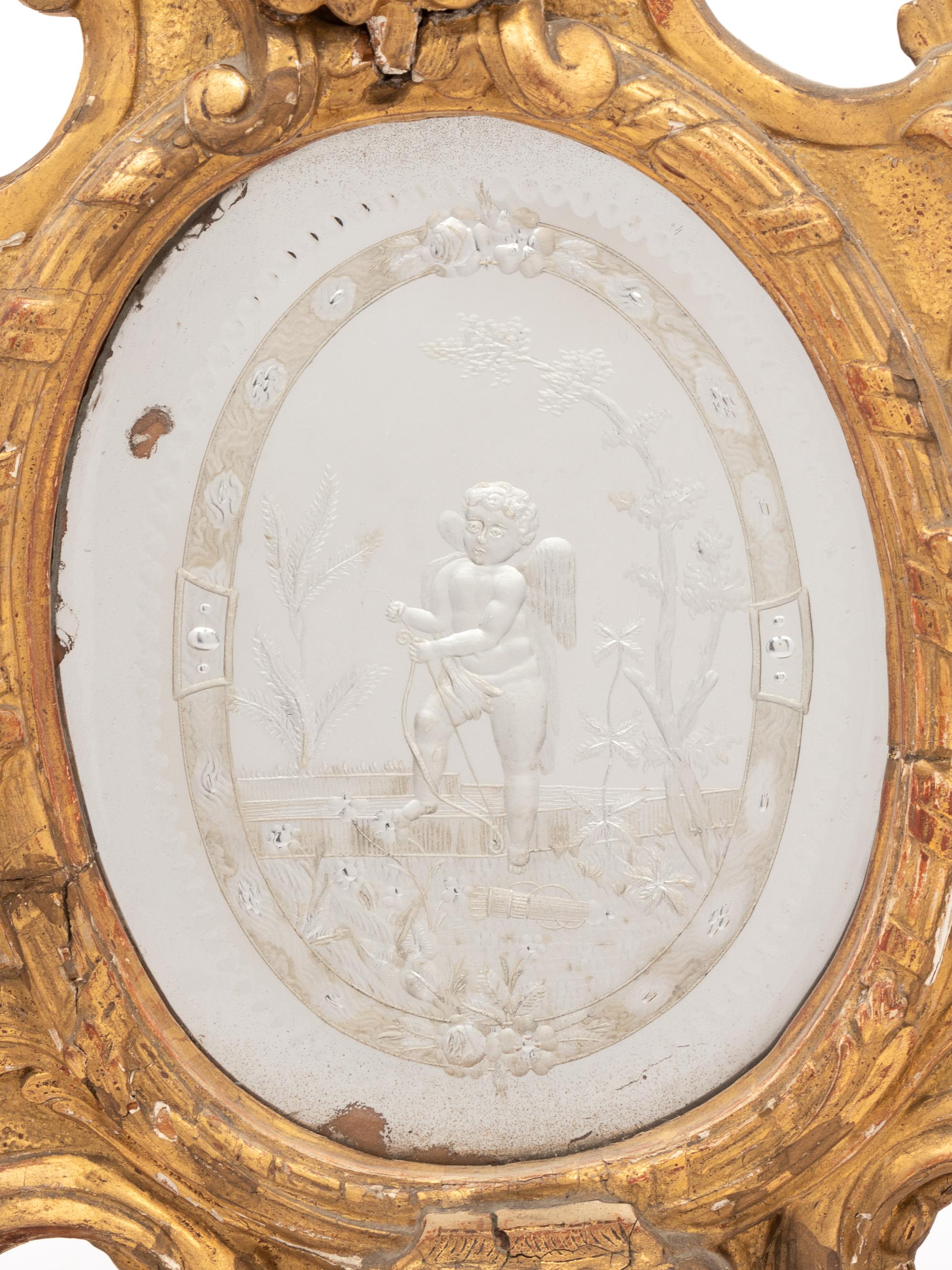 A Venetian Giltwood and Etched Glass Mirror