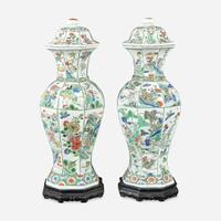 A pair of Chinese famille verte-decorated octagonal baluster vases and covers Kangxi period