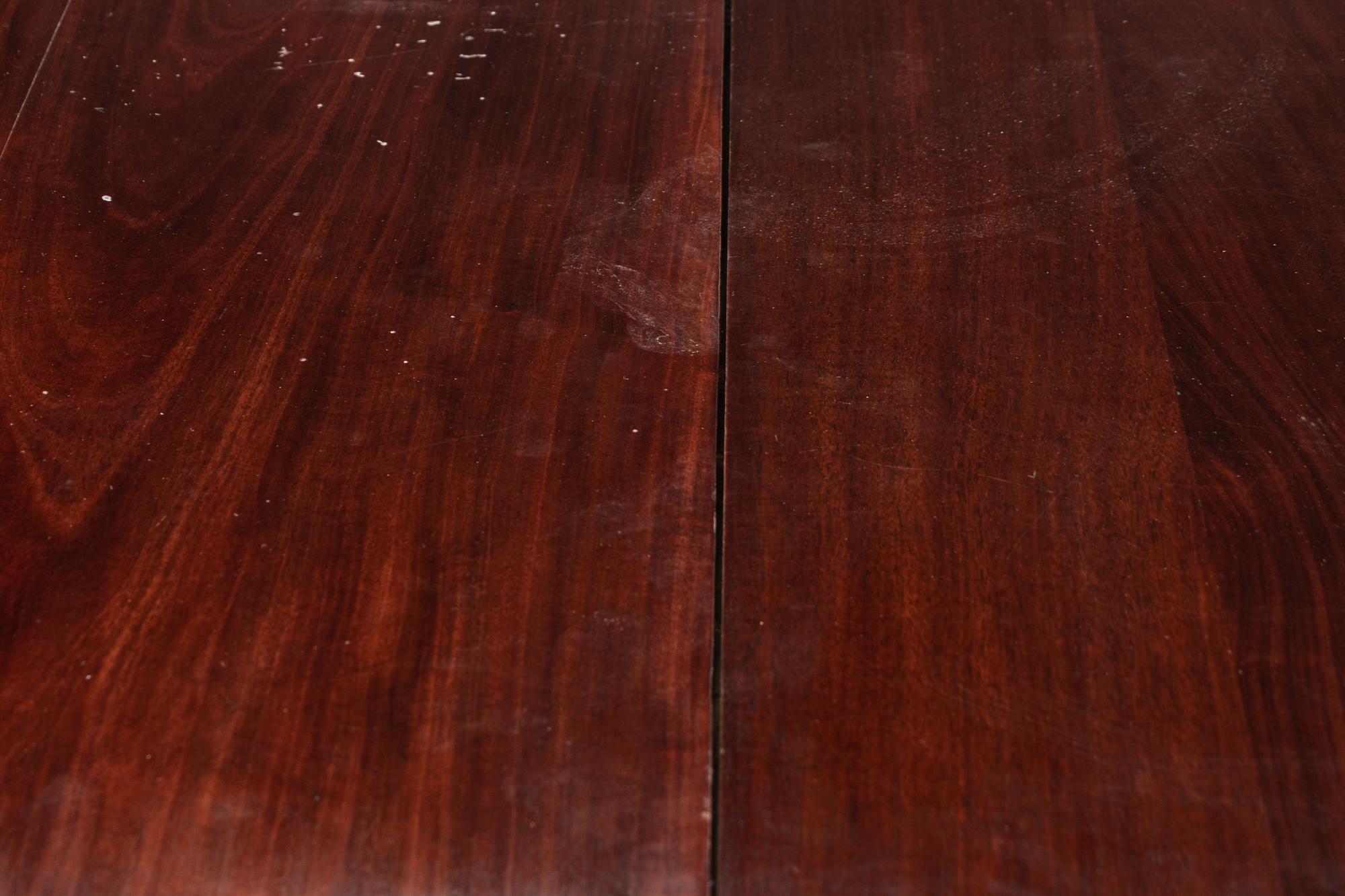 A Directoire Brass Mounted Mahogany Dining Table
