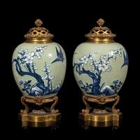 A Pair of Chinese Celadon Ground Blue and White Porcelain Jars with Later Ormolu Mounts, Porcelain: Kangxi Period, Mounts: Late 19th/Early 20th Century 銅鎏金鑲清康熙豆青地青花喜上眉梢圖罐一對