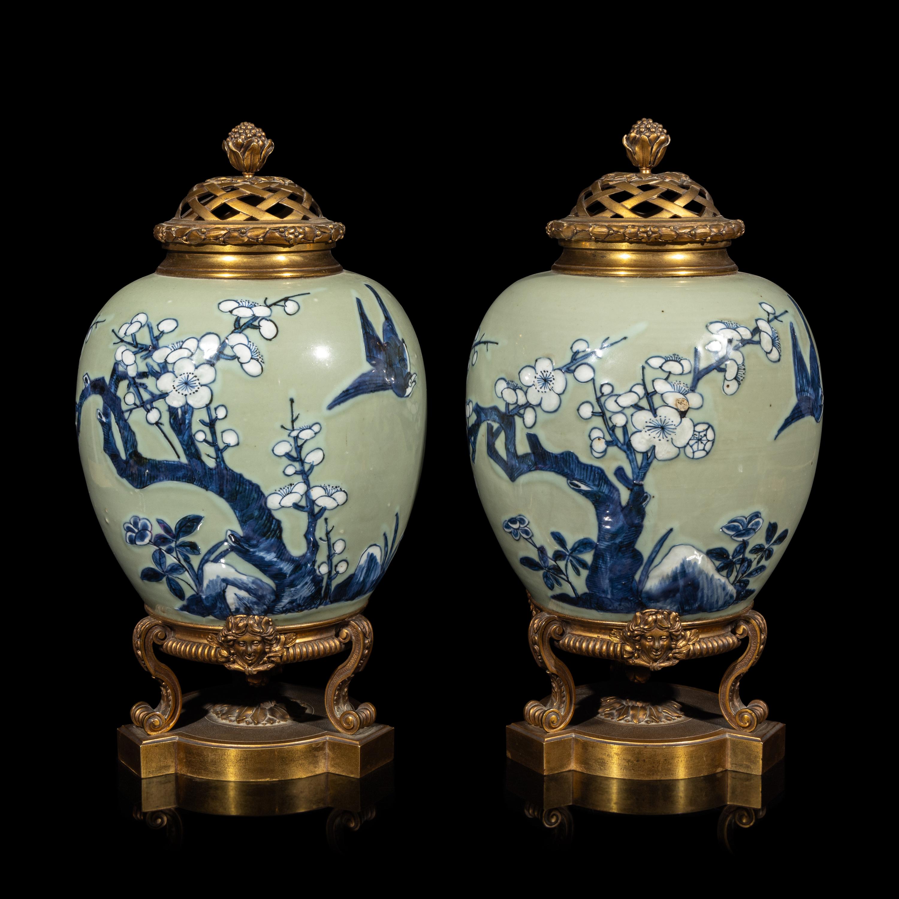 A Pair of Chinese Celadon Ground Blue and White Porcelain Jars with Later Ormolu Mounts, Porcelain: Kangxi Period, Mounts: Late 19th/Early 20th Century 銅鎏金鑲清康熙豆青地青花喜上眉梢圖罐一對