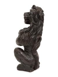 An English Carved and Stained Oak Figure of a Lion