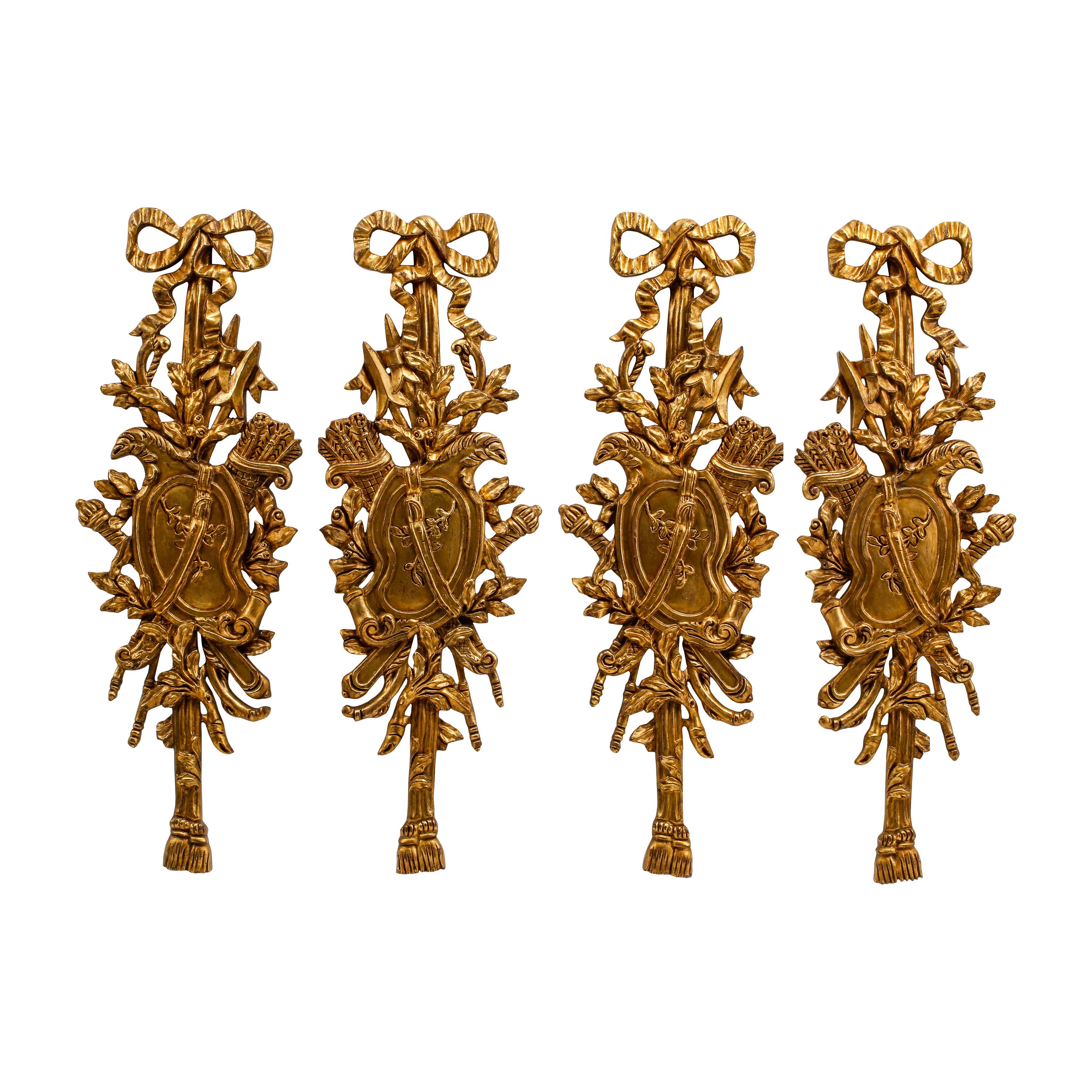A Set of Four Louis XV Style Giltwood Trophy Plaques