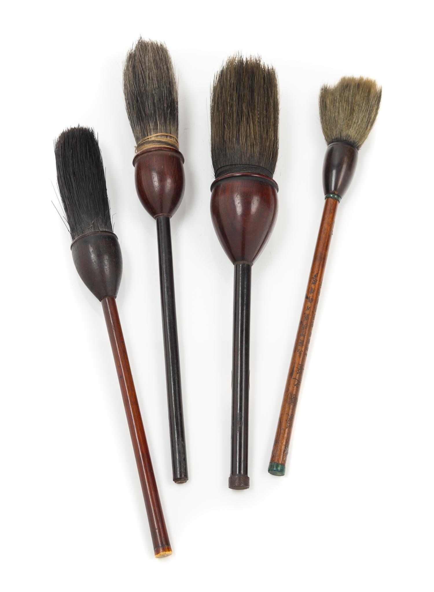 Four Chinese Hardwood Calligraphy Brushes Length of largest 7 inches. — QING DYNASTY (1644-1911)