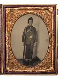 [CIVIL WAR]. Quarter plate tintype portrait of a very young, doubly armed private.