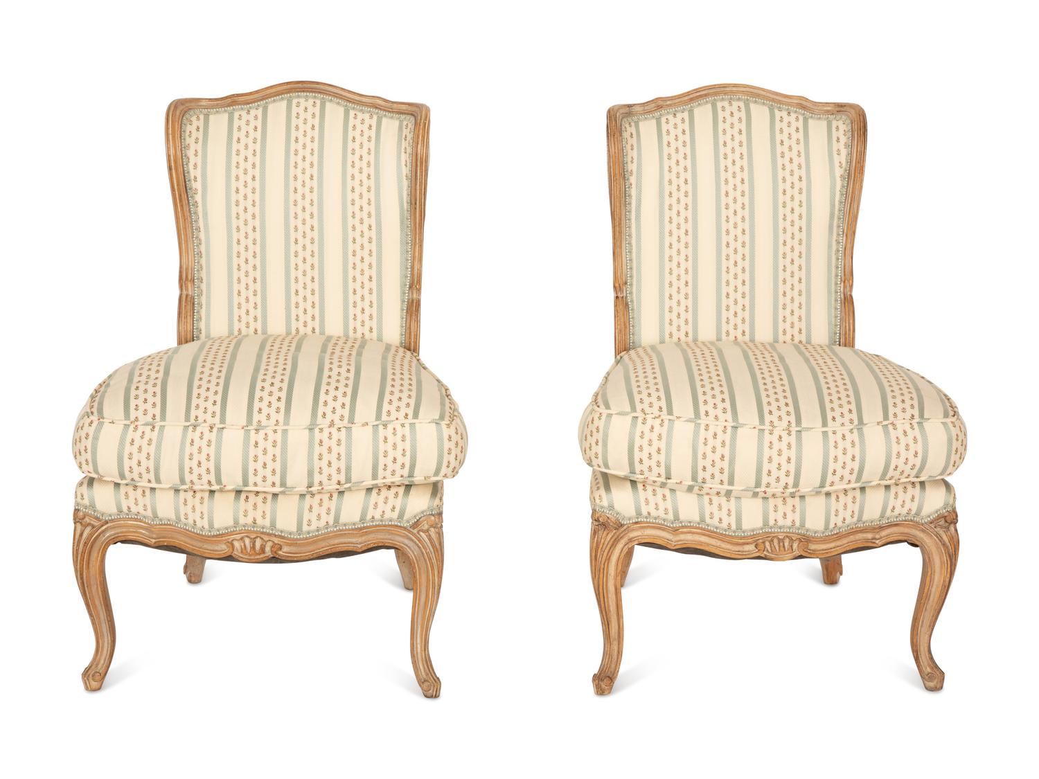 A Pair of Louis XV Style Carved Fruitwood Slipper Chairs