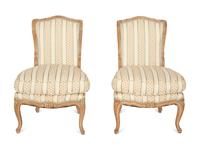 A Pair of Louis XV Style Carved Fruitwood Slipper Chairs