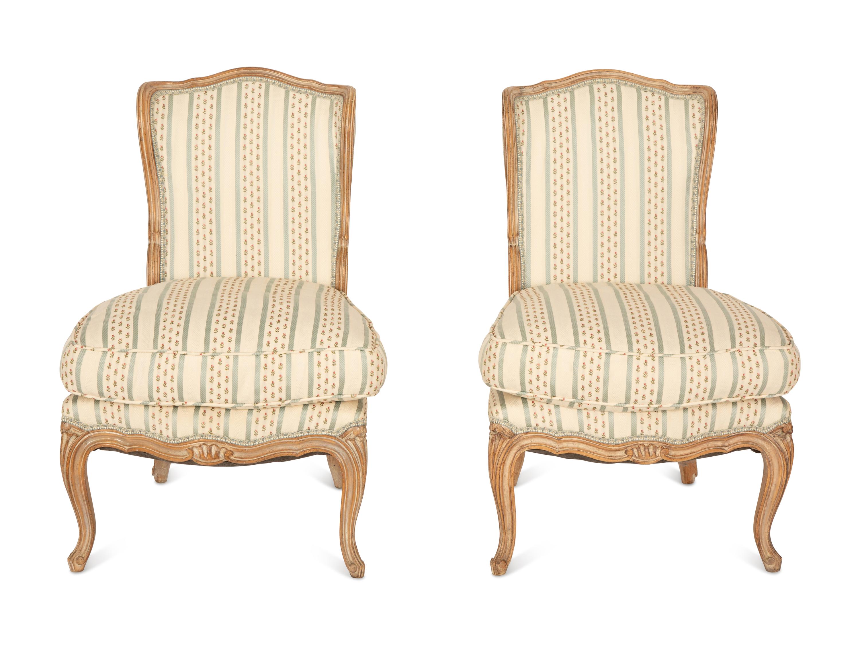A Pair of Louis XV Style Carved Fruitwood Slipper Chairs