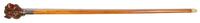 A Carved Wood Cane, Height overall 44 1/2 x height of handle 4 5/8 inches.