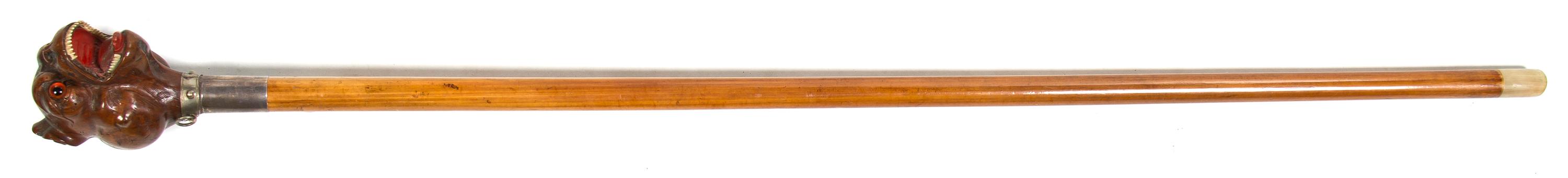 A Carved Wood Cane, Height overall 44 1/2 x height of handle 4 5/8 inches.