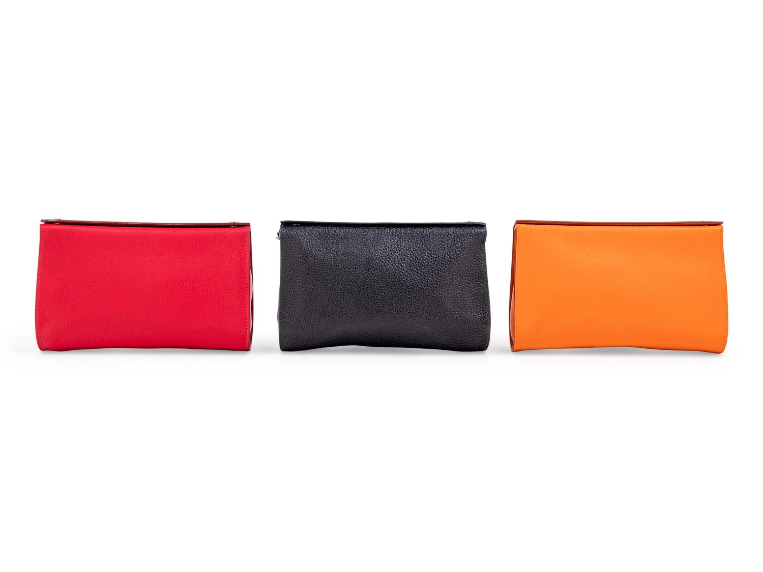 Three Hermès Leather Karo Trousse Cosmetic Bags, 2000-2013