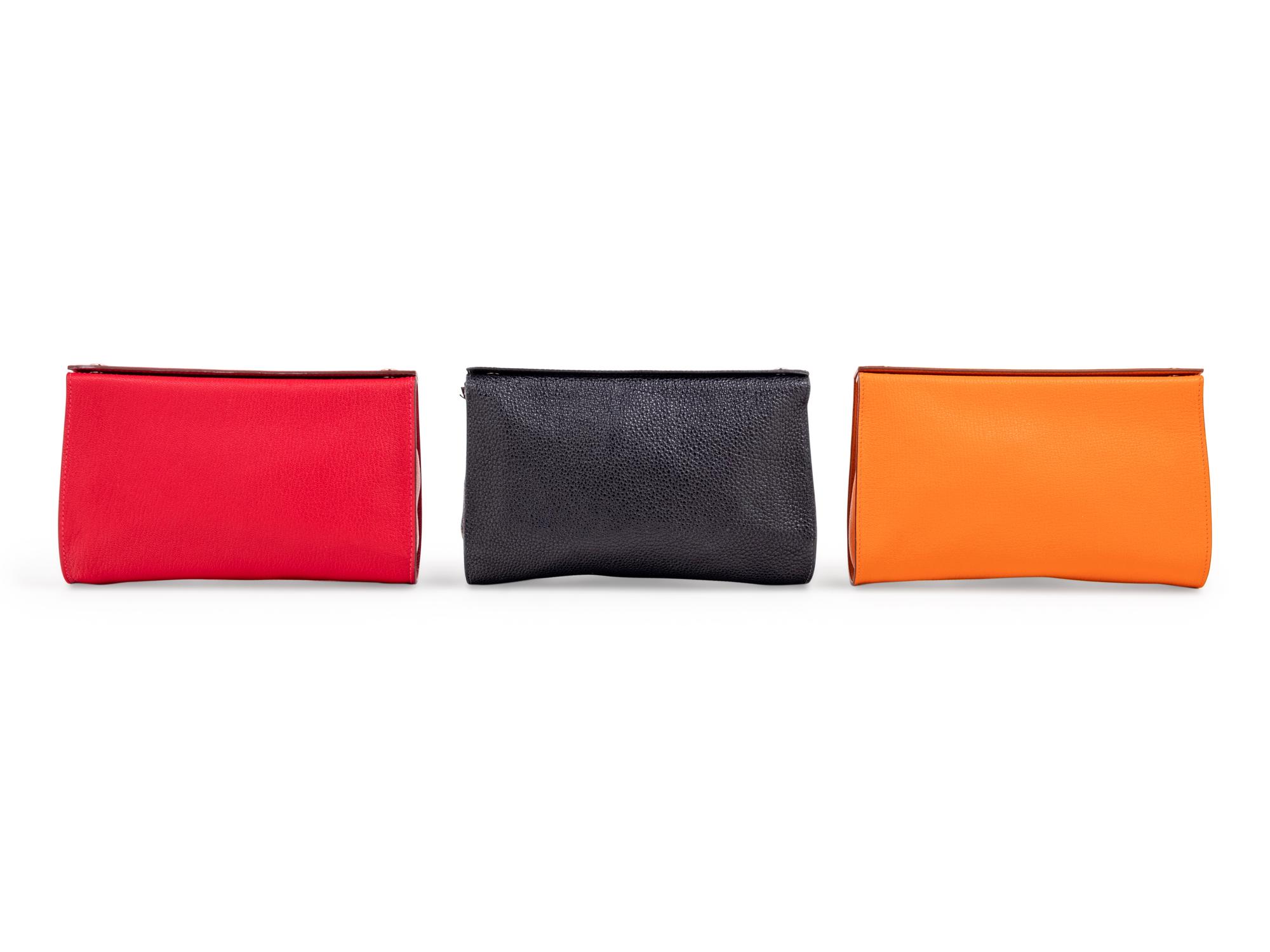 Three Hermès Leather Karo Trousse Cosmetic Bags, 2000-2013