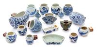 Eighteen Chinese Blue and White Porcelain and Cloisonne Enamel Bird Feeders Length of largest 3 3/8 inches. — 19TH CENTURY