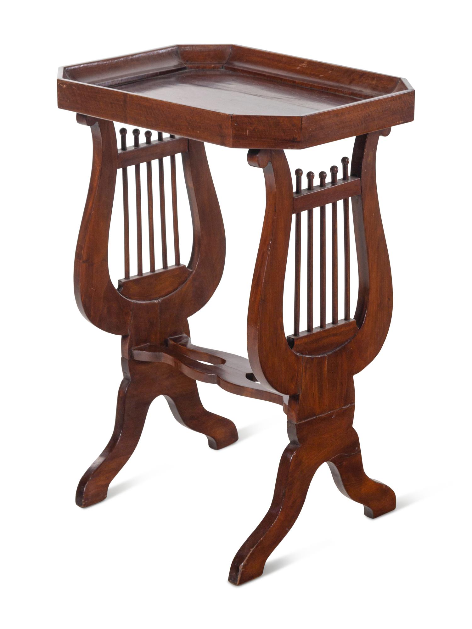 A Continental Mahogany Side Table with Lyriform Supports