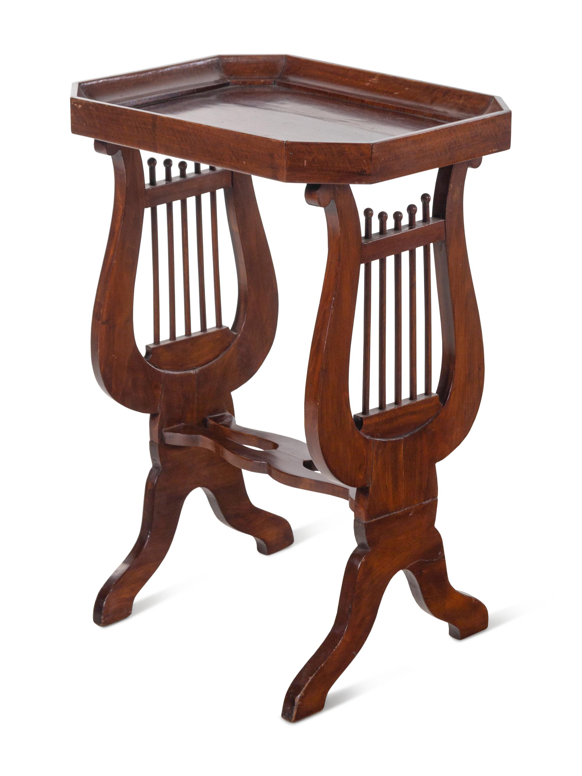 A Continental Mahogany Side Table with Lyriform Supports