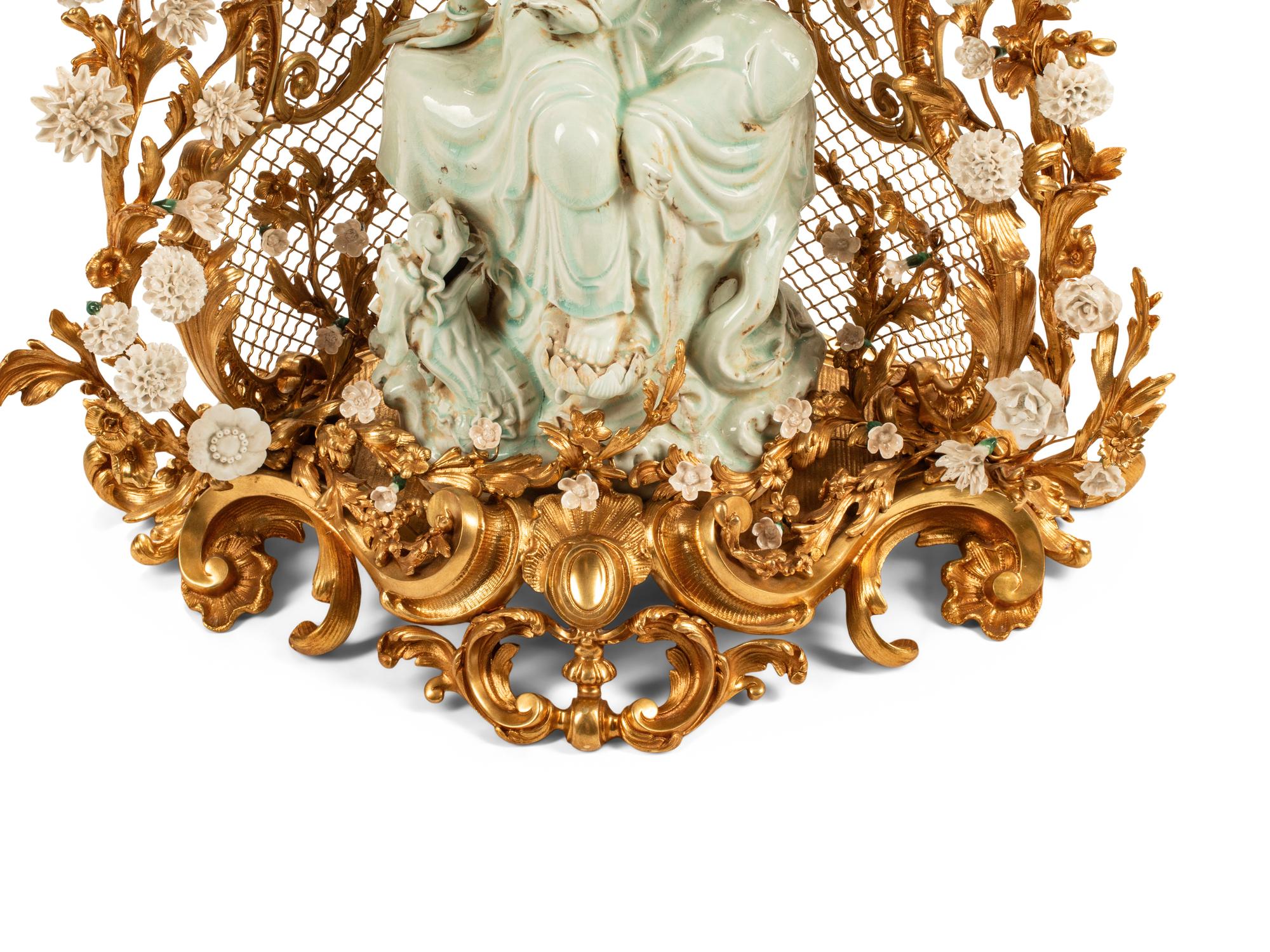 A Large Louis XV Style Gilt Bronze and White Porcelain Clock