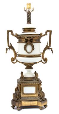 A Louis XVI Style Gilt Bronze Mounted White Ceramic Urn-form Lamp Height to bulb 28 x width 13 x depth 10 inches. — EARLY 20TH CENTURY