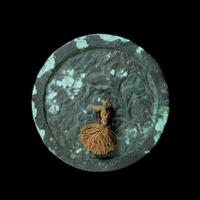 An Archaistic Bronze Mirror Diameter 7 3/4 inches.