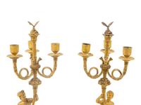 A Pair of French Gilt Bronze Figural Three-Light Candelabra