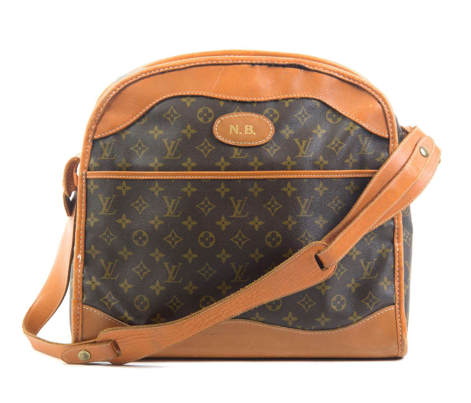 A Louis Vuitton Monogram Canvas Travel Bag, 15 x 15 x 7 1/8 inches.