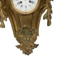 A Louis XVI Style Gilt Bronze Cartel Clock