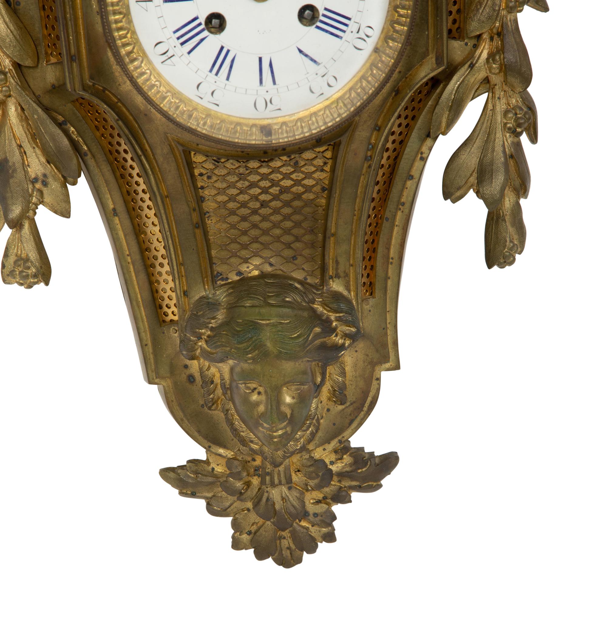 A Louis XVI Style Gilt Bronze Cartel Clock