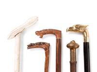 A Collection of Sixteen Carved and Mixed Metal Decorated Zoomorphic Walking Sticks