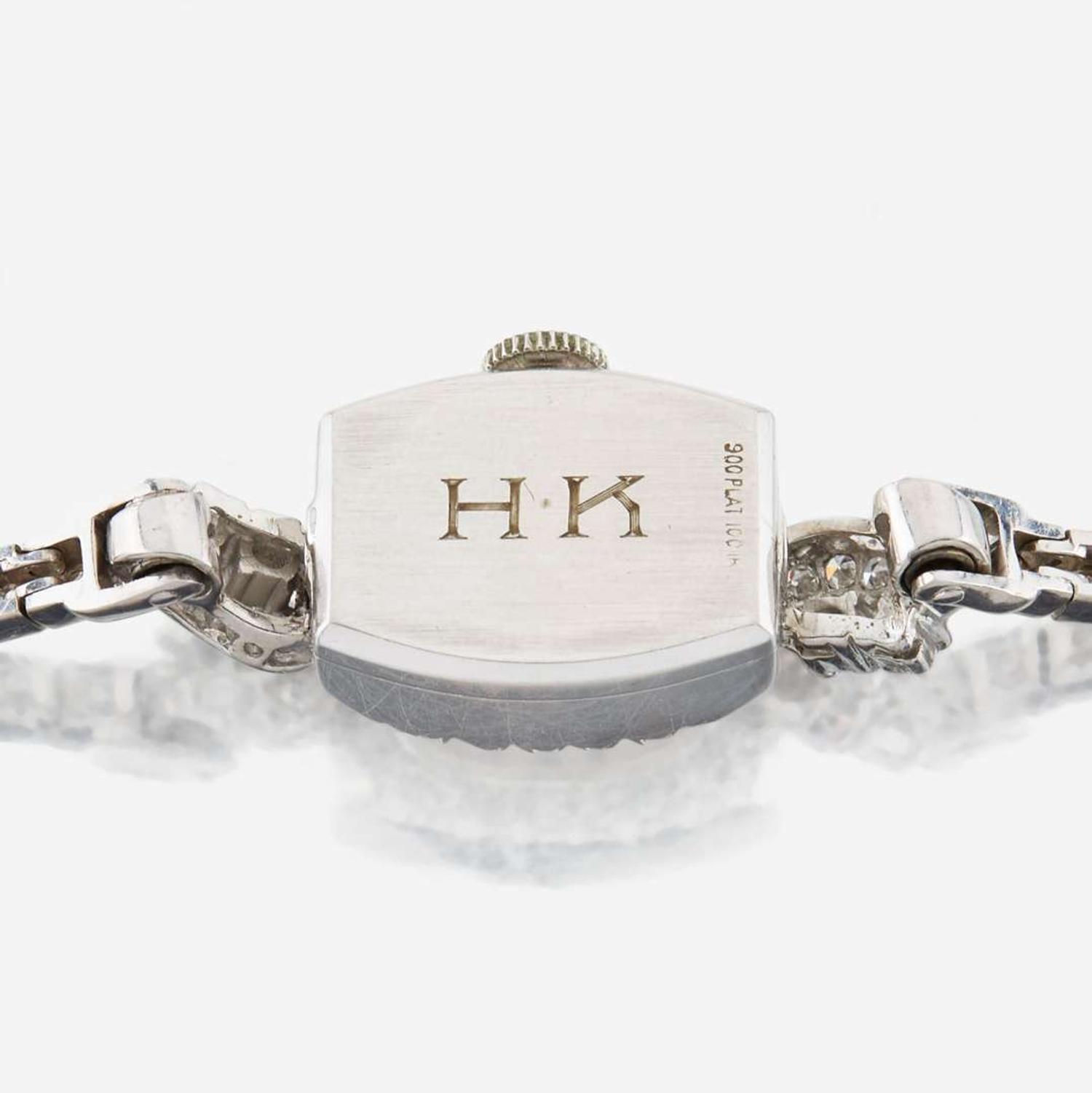 A lady's diamond and platinum bracelet watch, J.E Caldwell