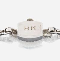 A lady's diamond and platinum bracelet watch, J.E Caldwell