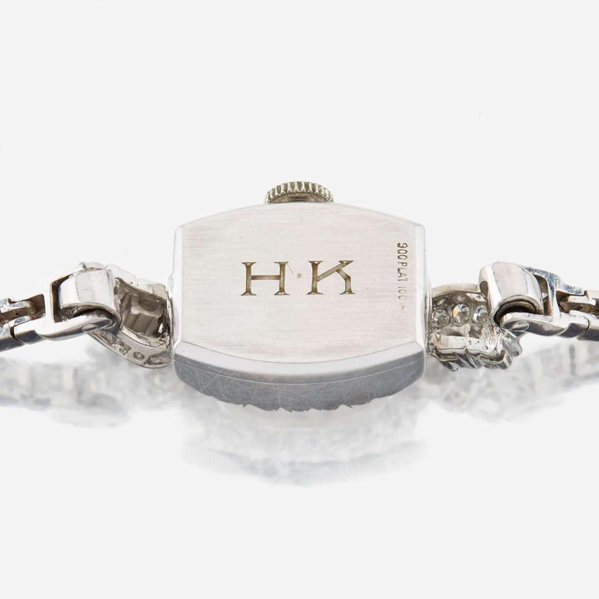 A lady's diamond and platinum bracelet watch, J.E Caldwell